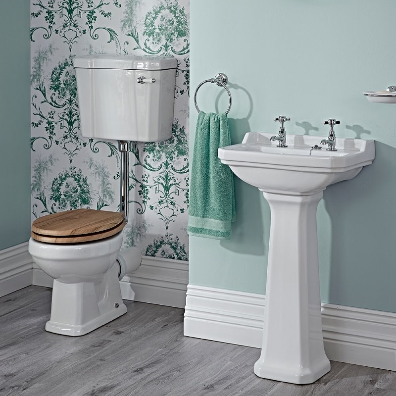 low level toilet in green vintage bathroom