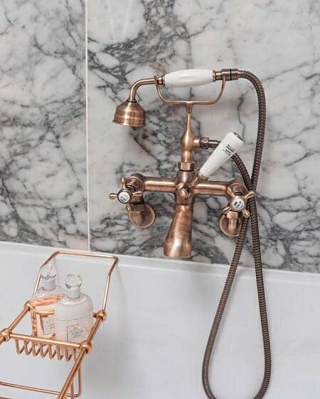 A bronze wall hung bath shower mixer tap in a new bathroom renovation