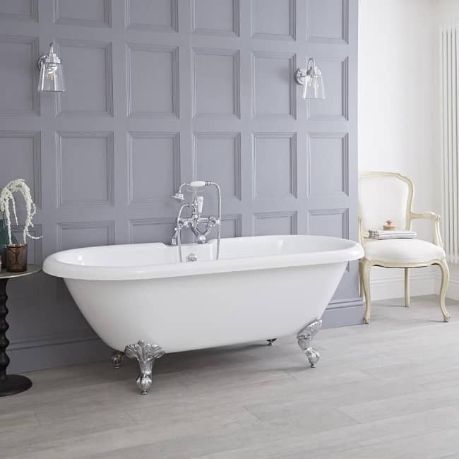 roll top freestanding bath with claw feet and traditional shower tap set