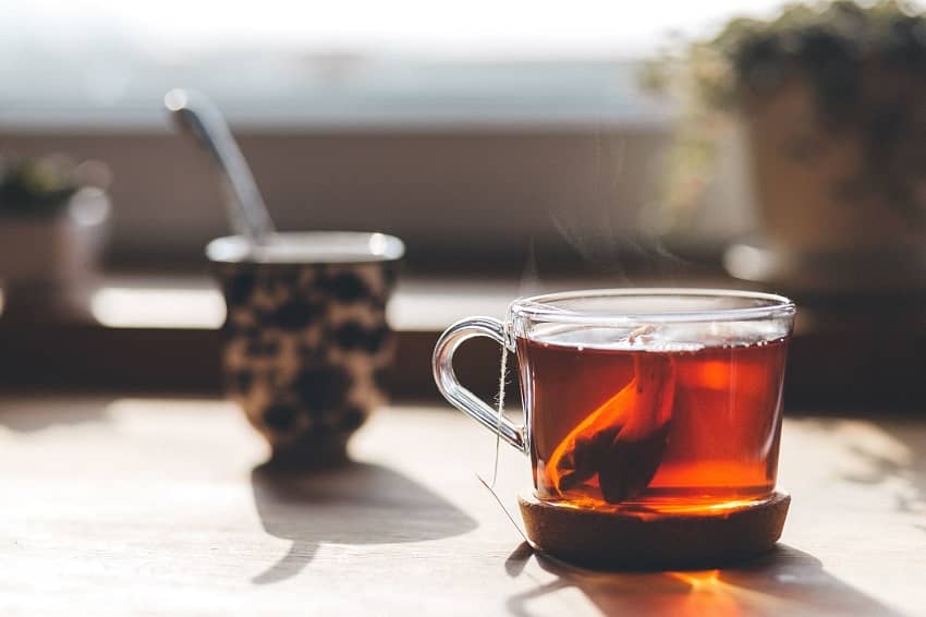 Glass tea cup with hot tea