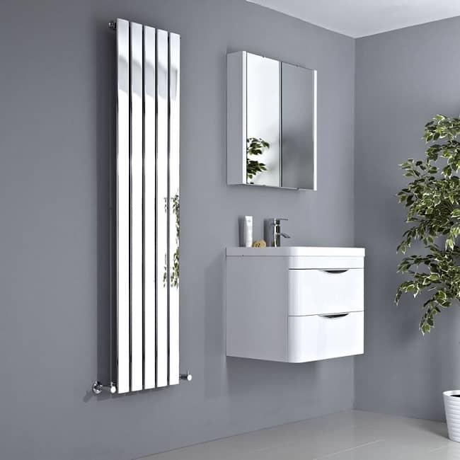 Chrome-vertical-designer-radiator with white wall hung vanity unit and white mirrored wall mounted cabinet