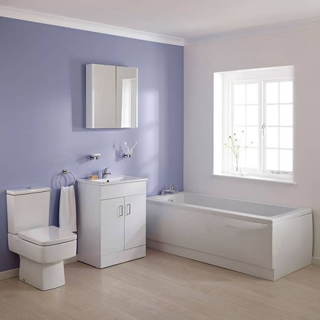 White rectangular bathroom suite in purple and white bathroom with window