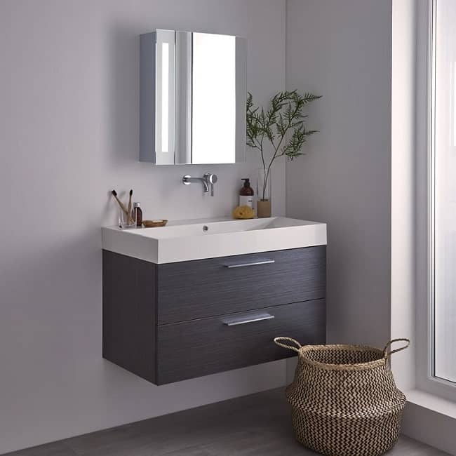 mirrored-bathroom-cabinet with vanity unit and wall mounted tap
