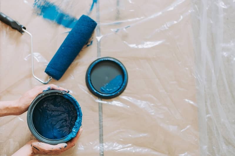 Blue paint pot and paint roller