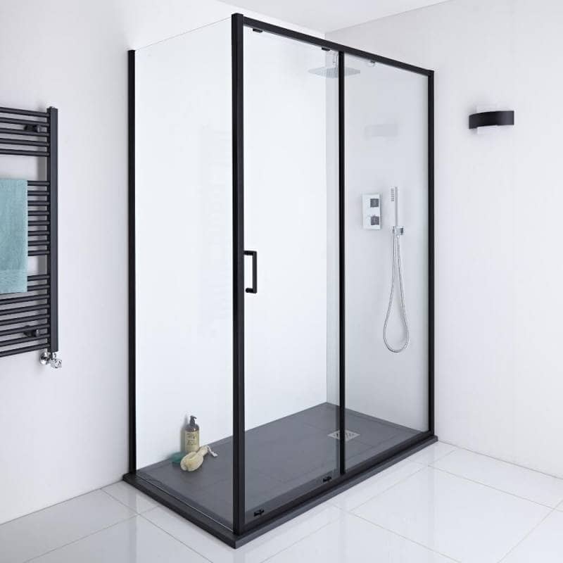 Black framed sliding shower door enclosure with black slate shower tray