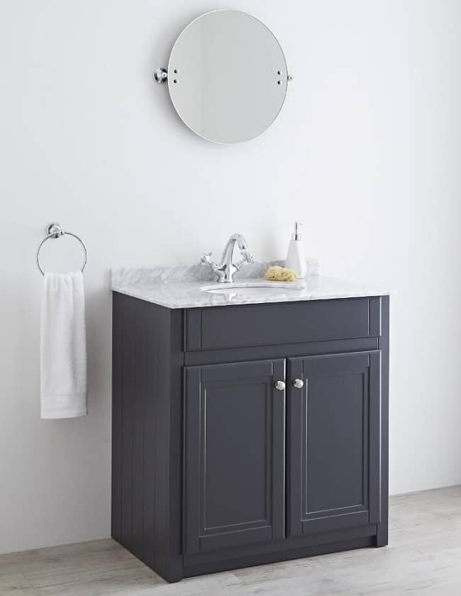 round bathroom mirror with anthracite floor mounted vanity unit with marble counter top