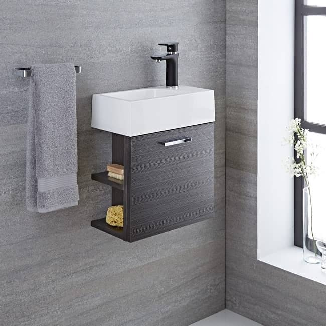 cloakroom vanity unit in a grey finish with open shelves to the left
