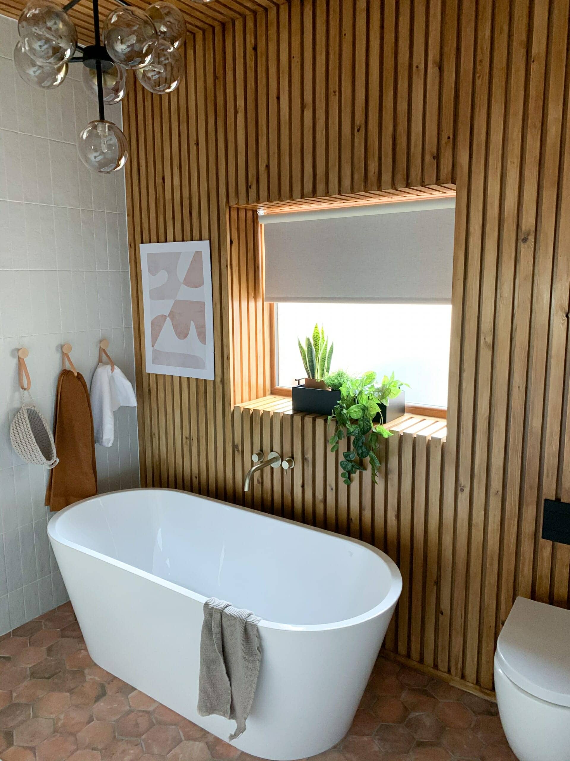 scandi style bathroom with freestanding bath