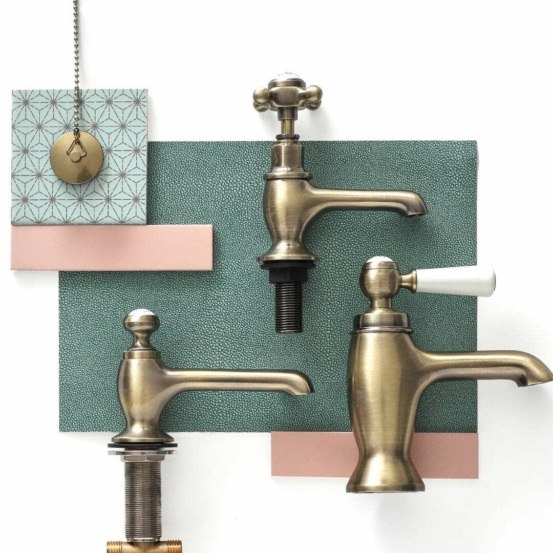 a flat lay of gold bathroom taps