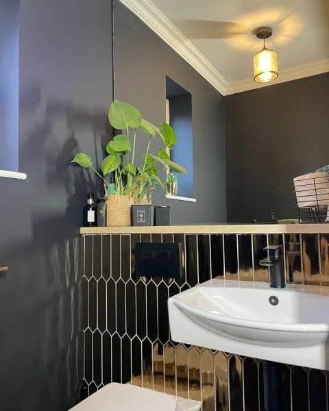 a black coloured mood boosting bathroom