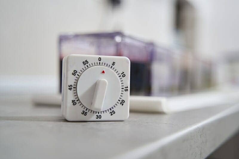 Close-up photo of timer on the table is counting down the time in a bathroom