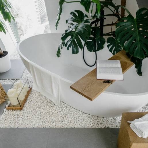 Wellness bath, candle and plants