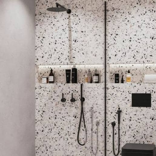 Terrazzo tiles and black shower