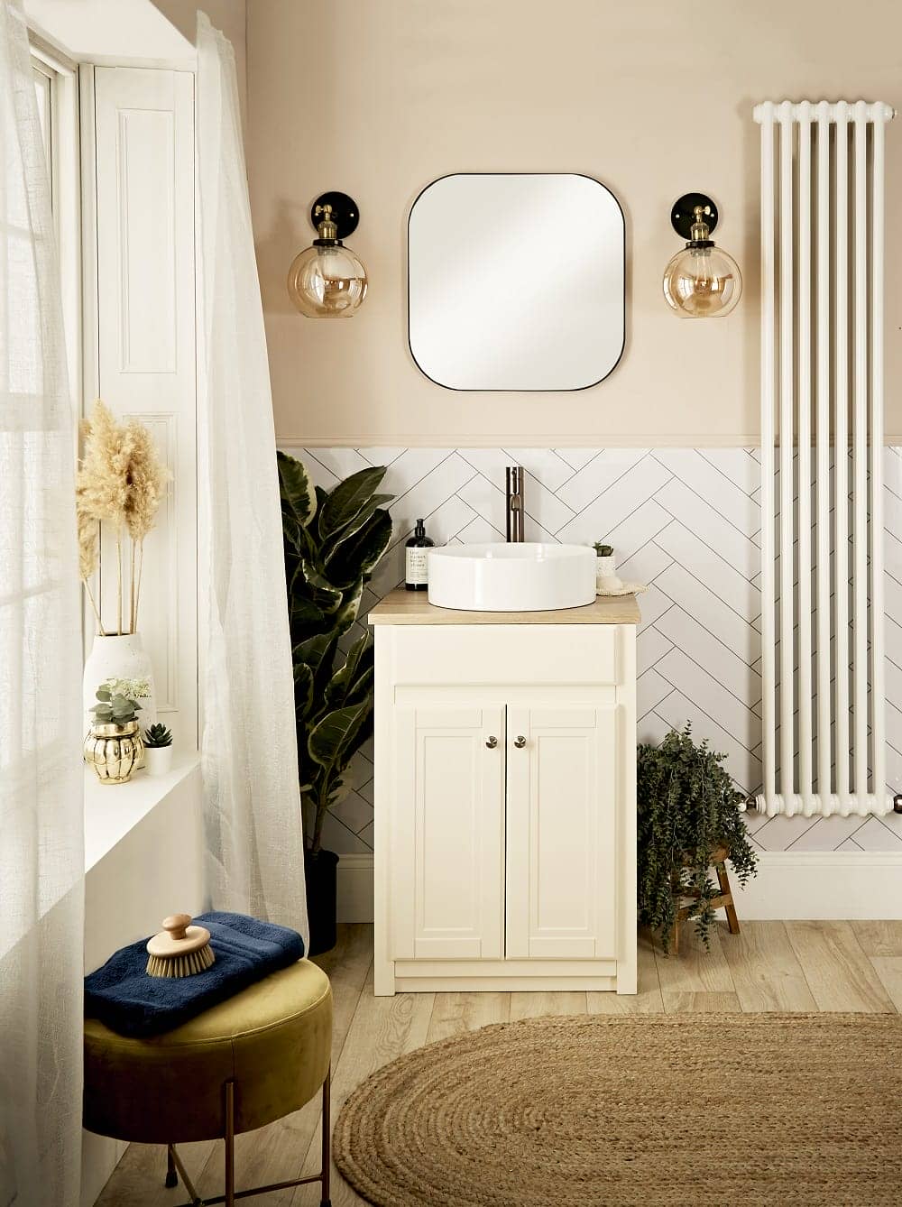 a cottagecore style wash space with a vertical radiator to the right of the basin 