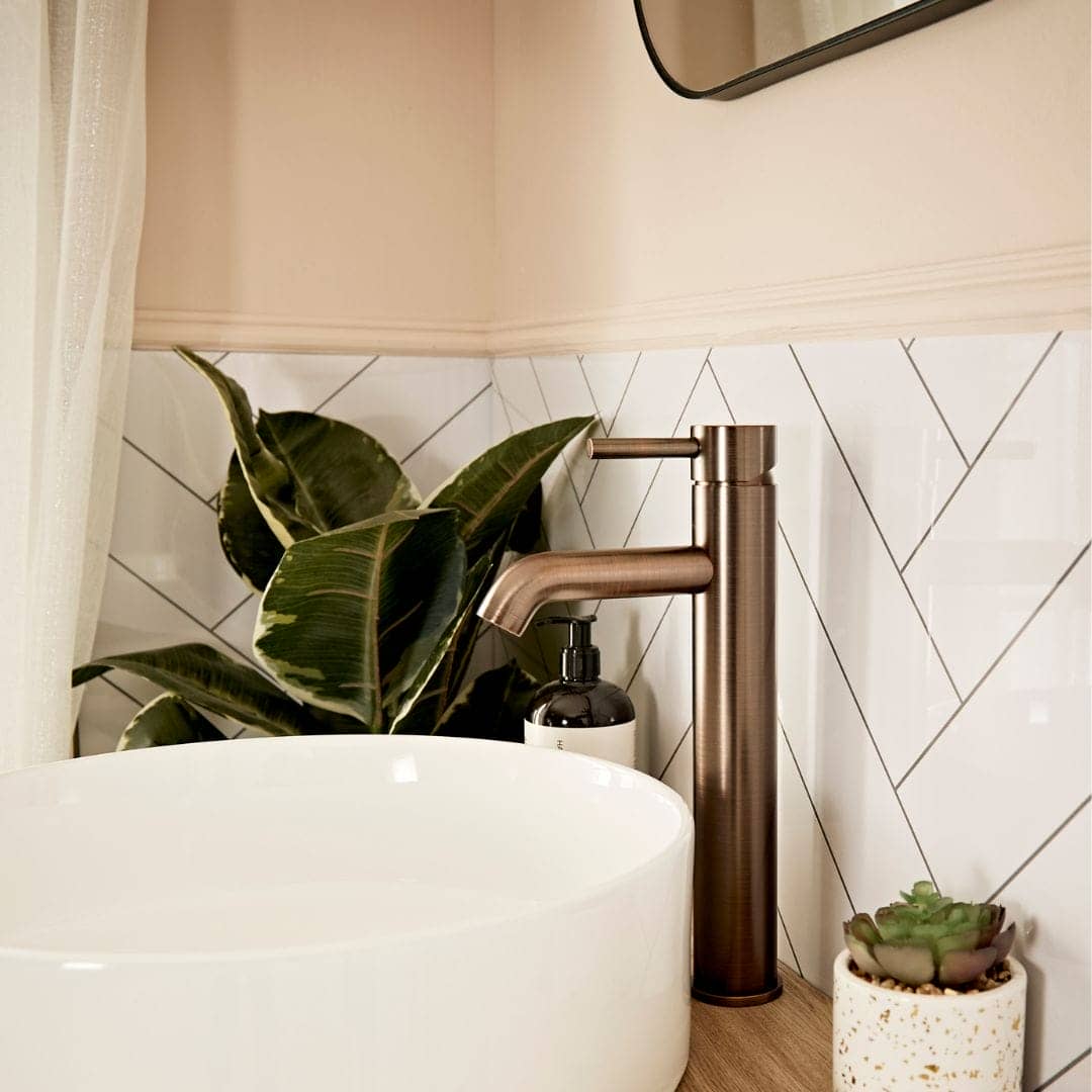 close up of basin in a very demure bathroom space.